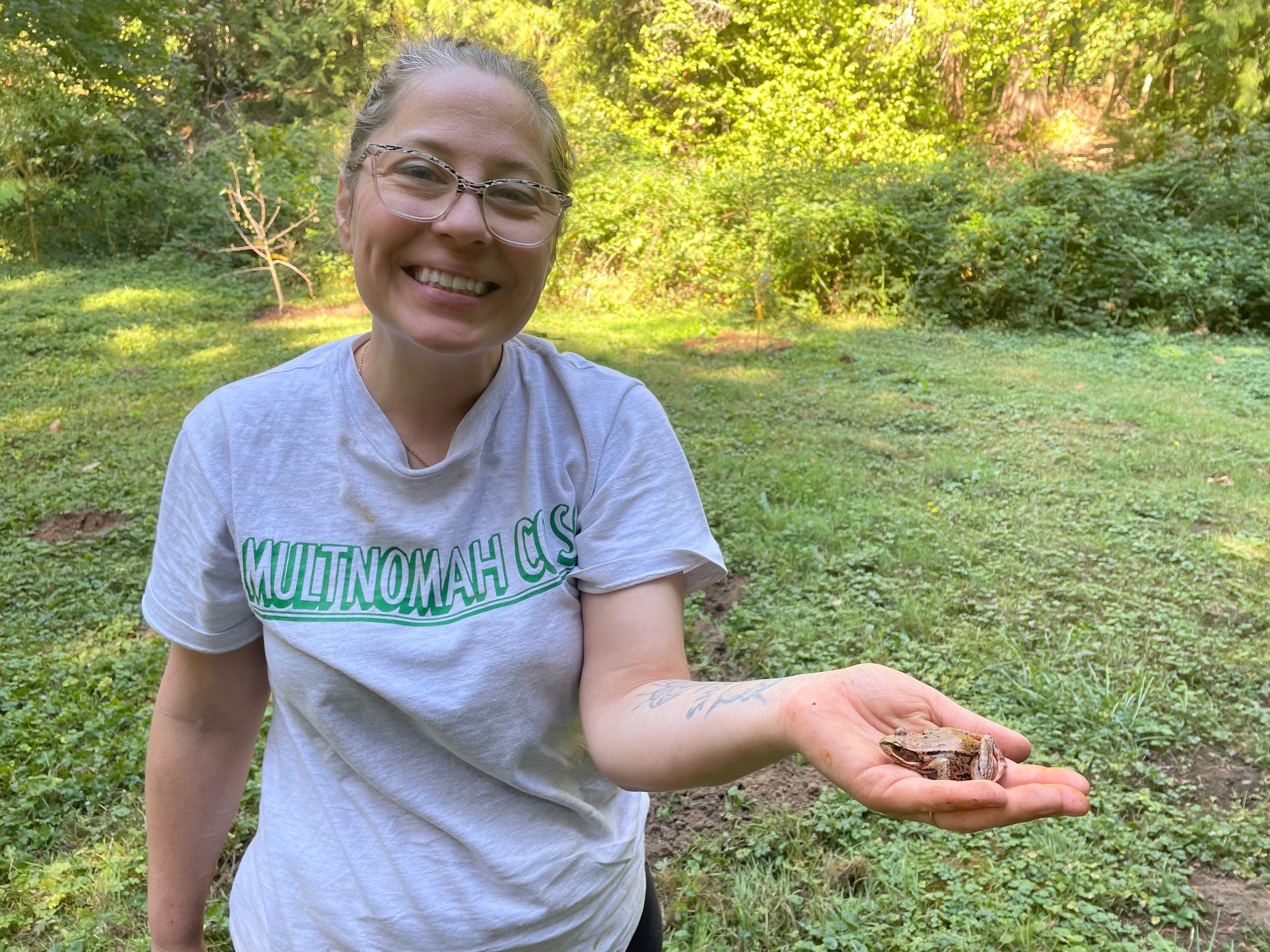 Moving little frog out of danger as we plant trees